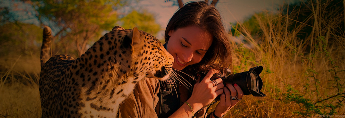 a photographer with a cheetah