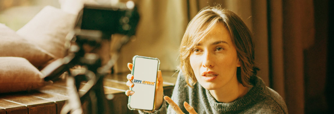 A woman holding up her phone